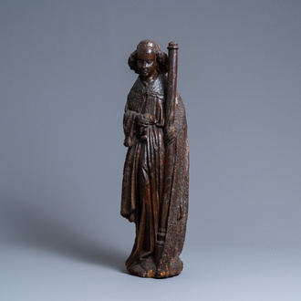 An oak figure of an angel holding the Instruments of the Passion, Brabant region, Southern Netherlands, early 15th C.