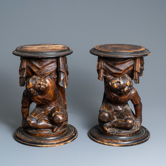 A pair of patinated coniferous wood candle supports in the shape of kneeling Moors, Venice, Italy, 17/18th C.