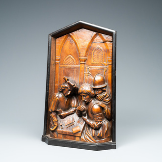 A boxwood relief panel depicting 'Cheaters playing cards' in an ebony and oak frame, monogrammed DLC, 19th C.