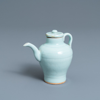 A Chinese monochrome celadon-glazed ewer and cover with incised design, Qianlong