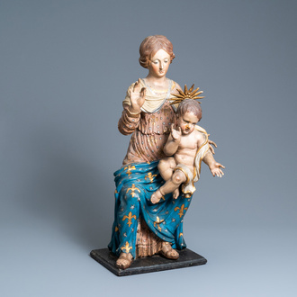 A large polychromed wooden figure of a Madonna with child, 17th C.