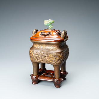 A Chinese partly gilded bronze censer with jade-topped wooden cover, Xuande mark, Kangxi