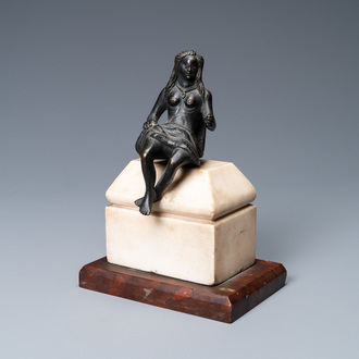 A black-patinated bronze figure of a young lady wearing a loincloth mounted on a marble base, Italy, 16th C.