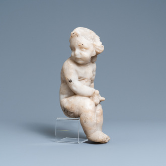 An alabaster figure of a putto with a bird on the knee, 17th C.