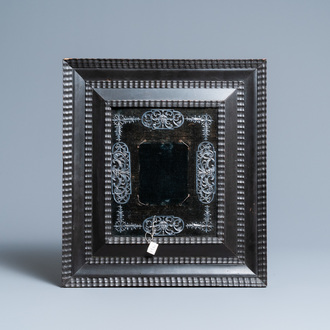 A blackened pearwood frame with pewter ornaments, 17th C.