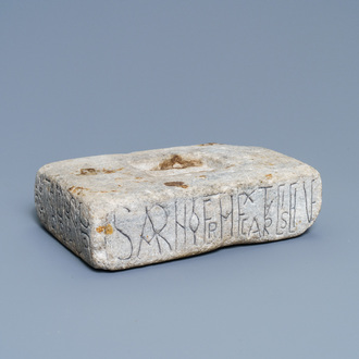 An inscribed Romanesque reliquary altar stone, France, 12th C.