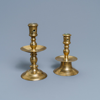 A Flemish bronze capstan candlestick and a disc candlestick, 16/17th C.