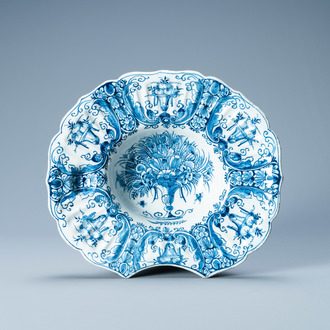 A gadrooned Dutch Delft blue and white shaving bowl, 18th C.