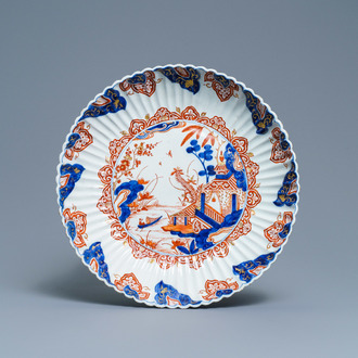 A fluted Dutch Delft doré chinoiserie dish with a pagoda in a landscape, 1st quarter 18th C.