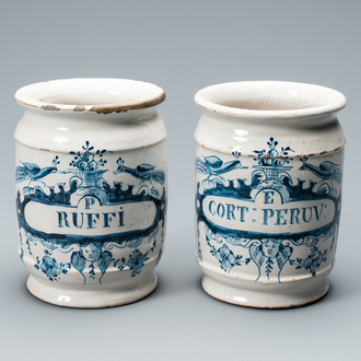 A pair of Dutch Delft blue and white albarello type drug jars, 18th C.