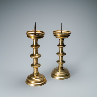 A composite pair of brass alloy candlesticks, Germany, 16th C.