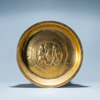 A brass alms basin depicting 'The Spies of Canaan', Nuremberg, Germany, 16th C.