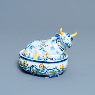 A polychrome Dutch Delft butter tub and cow cover, 18th C.