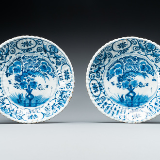 A pair of ribbed Dutch Delft blue and white 'tea tree' plates, 18th C.