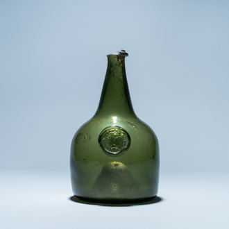 A green glass wine bottle with a crowned alliance seal, 17th C.