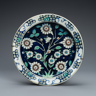A blue-ground Iznik-style pottery dish, Kütahya, Turkey, 19th C.