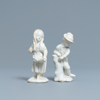 Two white Dutch Delftware figures of a boy and a girl, 18th C.