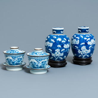 A pair of Chinese blue and white covered bowls on stands and a pair of covered jars, 19th C.