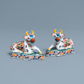 A pair of polychrome Dutch Delft models of cows, 18th C.