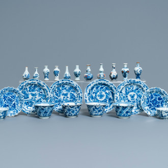 Six Chinese blue and white cups and saucers and eleven miniature vases, Kangxi