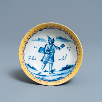 A polychrome Dutch Delft deep saucer dish inscribed 'Jakop rebel', 18th C.