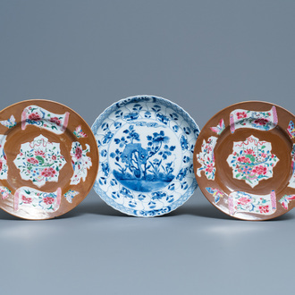 A pair of Chinese famille rose plates, Qianlong, and a blue and white plate, Kangxi mark and of the period