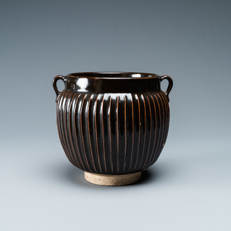 A Chinese black-glazed ribbed two-handled jar, Northern Song or Jin