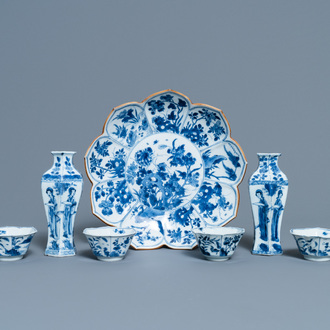 A pair of Chinese blue and white vases, a 'lotus' dish and four cups, Kangxi