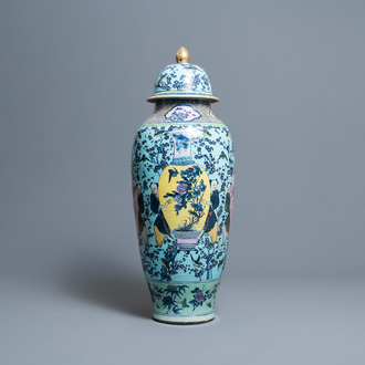 A very large Chinese famille rose turquoise-ground vase and cover, 19th C.