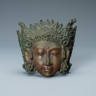 A bronze mask of a female deity, Tibet or South East Asia, 19th C.