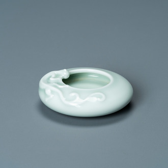 A Chinese celadon-glazed 'dragon' brush washer, Qianlong mark, 19/20th C.