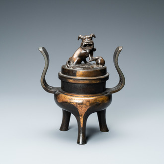 A Chinese partly gilded bronze tripod censer and cover, Ming