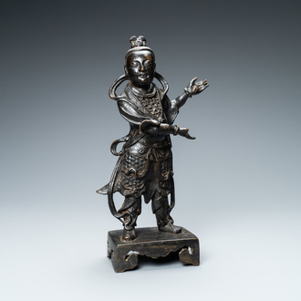 A Chinese bronze figure of a servant, Ming