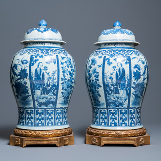 A pair of large Chinese blue and white covered vases, 19th C.