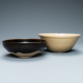 A Chinese black-glazed Cizhou bowl and a cream-glazed incised bowl, Song and/or later