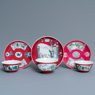 Three Chinese famille rose ruby-ground cups and saucers, Yongzheng