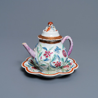 A Chinese famille rose relief-decorated teapot on stand, Yongzheng