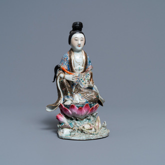 A Chinese famille rose figure of a lady on a lotus throne, 19th C.