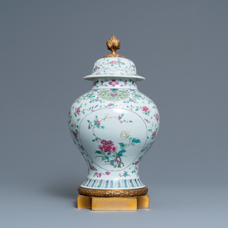 A Chinese famille rose vase and cover with gilt bronze mounts, 19th C.