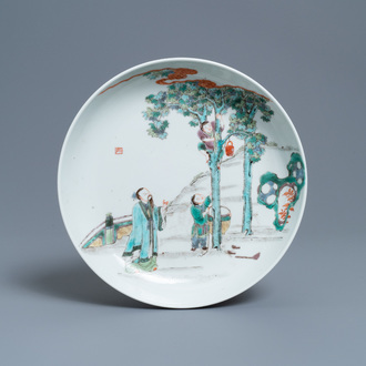 A Chinese famille verte dish with a boy in a tree, Yongzheng