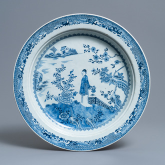 A large deep Chinese blue and white dish with a lady, Qianlong