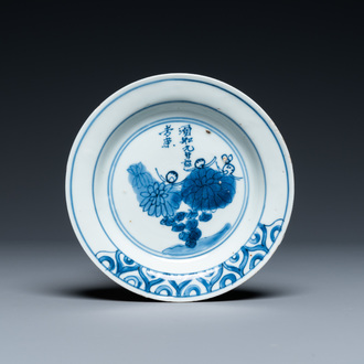 A Chinese blue and white 'chrysanthemum' dish with a poem, Tianqi mark and of the period