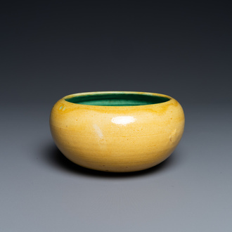 A Chinese monochrome yellow alms bowl with green interior, Kangxi