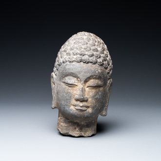 A Chinese stone carving of a Buddha head, Ming