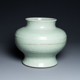 A Chinese monochrome celadon vase with underglaze floral design, Chenghua mark, Kangxi
