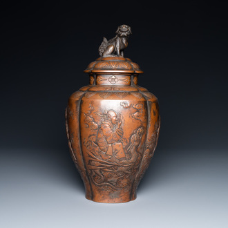 A Japanese hammered brass vase and cover, Meiji, 19th C.