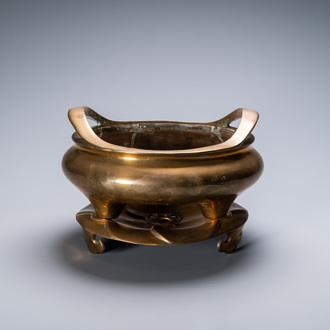 A Chinese bronze tripod censer on stand, Qianlong mark, Qing