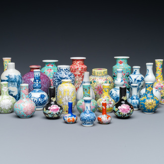 Twenty-eight Chinese blue and white and famille rose minature vases, Kangxi and later