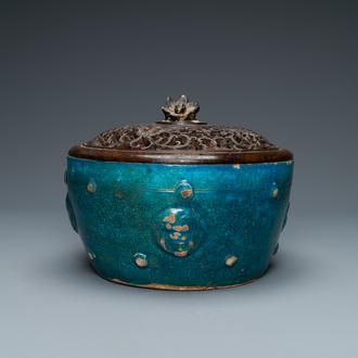 A Chinese monochrome turquoise-glazed bowl with reticulated wooden cover, Ming