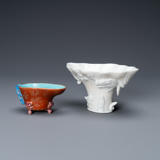 A Chinese blanc de Chine libation cup and a gilt-decorated coral-ground one, Kangxi and 19th C.
